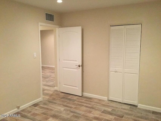 4832 E Cambridge Ave, Phoenix, AZ 85008 - unfurnished bedroom featuring recessed lighting, light wood finished floors, baseboards, and a closet