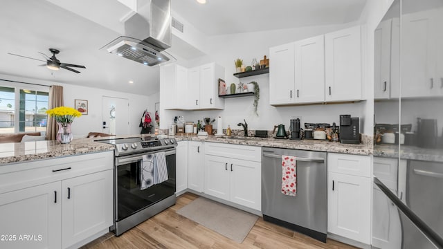 1717 W Roma Ave, Phoenix, AZ 85015 - kitchen featuring stainless steel appliances, wall chimney exhaust hood, open shelves, a sink, and a ceiling fan