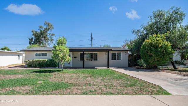 1717 W Roma Ave, Phoenix, AZ 85015 - ranch-style home with covered porch, a front lawn, and driveway