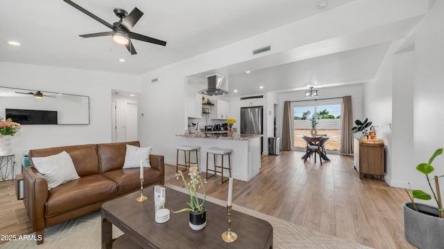 1717 W Roma Ave, Phoenix, AZ 85015 - living room with a ceiling fan, light wood-type flooring, baseboards, and recessed lighting