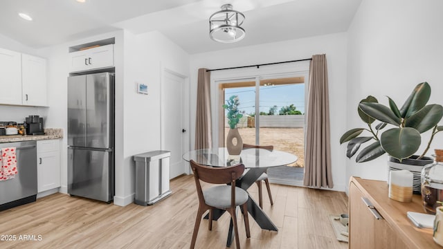 1717 W Roma Ave, Phoenix, AZ 85015 - dining room featuring light wood-style flooring, recessed lighting, and baseboards