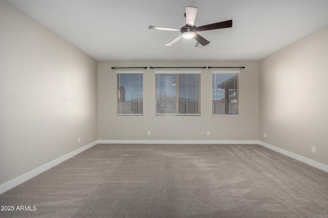 spare room with carpet and ceiling fan