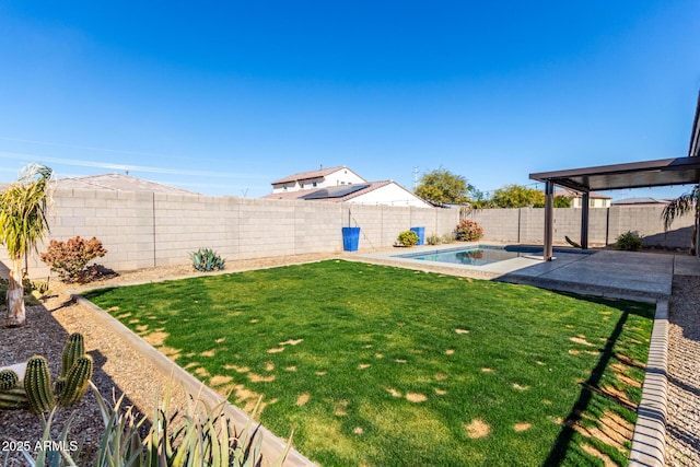 view of yard featuring a fenced in pool and a patio