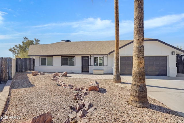 single story home featuring a garage