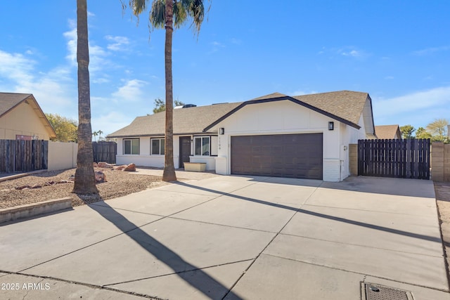 single story home with a garage