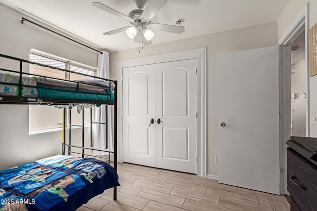 bedroom featuring a closet, ceiling fan, and wood finish floors