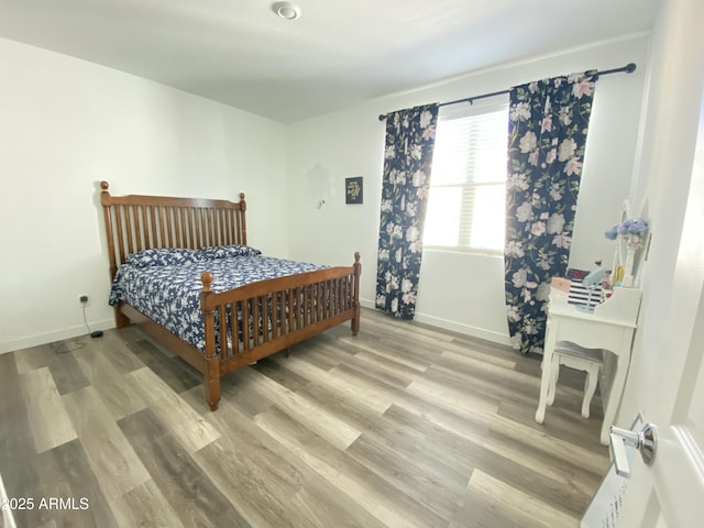 bedroom with light hardwood / wood-style floors