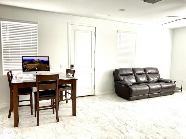 dining space with ceiling fan