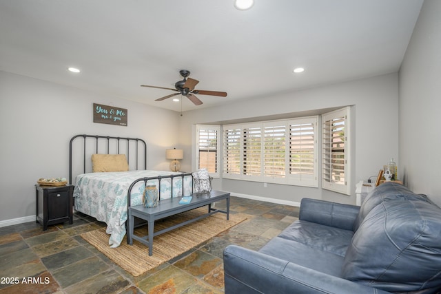 bedroom featuring stone tile floors, recessed lighting, baseboards, and a ceiling fan