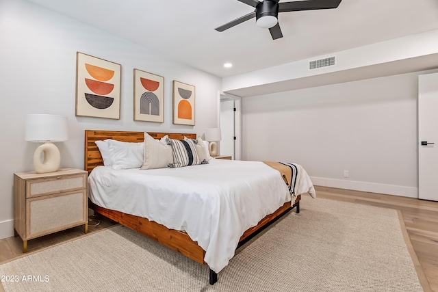 bedroom featuring ceiling fan and hardwood / wood-style floors