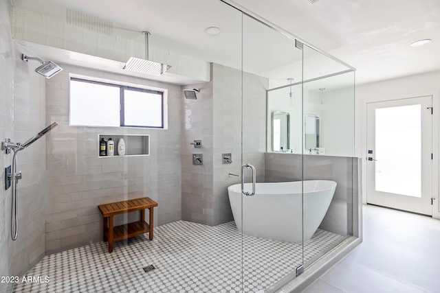 bathroom featuring separate shower and tub, tile patterned floors, and plenty of natural light