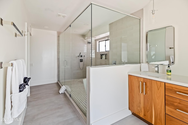 bathroom with vanity and an enclosed shower