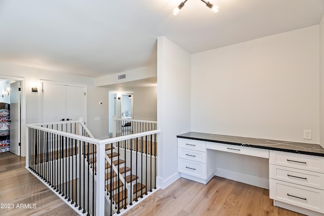 corridor featuring light hardwood / wood-style flooring