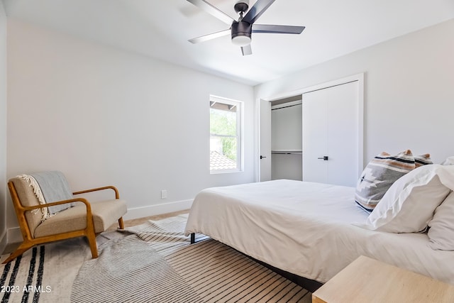 bedroom featuring carpet floors, a closet, and ceiling fan