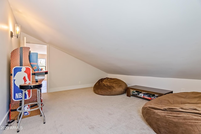 interior space featuring carpet and vaulted ceiling