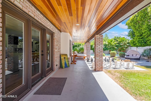 view of patio featuring a fireplace