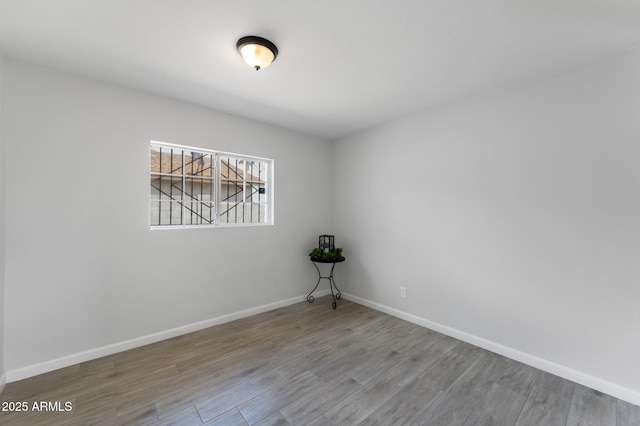 4207 W Culver St, Phoenix, AZ 85009 - empty room with wood finished floors and baseboards
