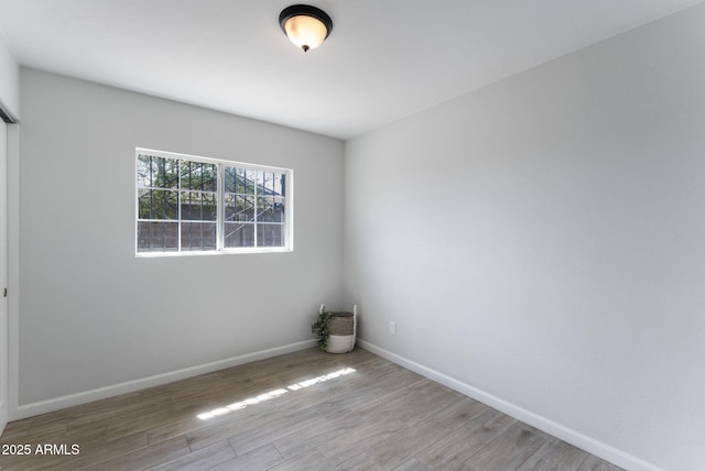 4207 W Culver St, Phoenix, AZ 85009 - empty room featuring wood finished floors and baseboards