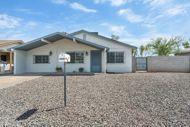 4207 W Culver St, Phoenix, AZ 85009 - view of front facade with a gate, stucco siding, and fence