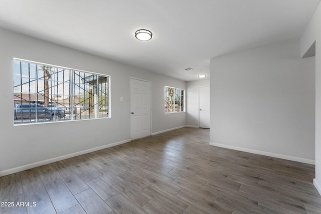 4207 W Culver St, Phoenix, AZ 85009 - spare room featuring wood finished floors and baseboards