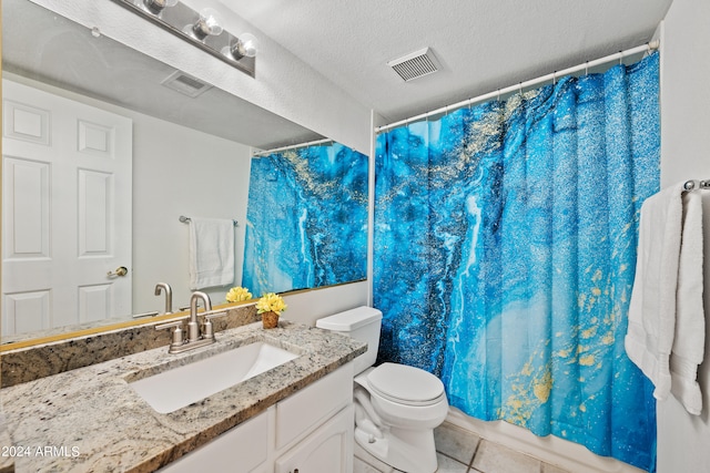 bathroom with vanity, a textured ceiling, walk in shower, toilet, and tile patterned floors