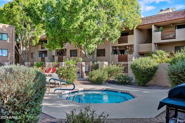 view of pool with area for grilling