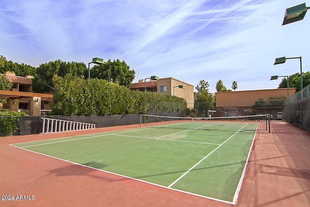 view of sport court with basketball hoop