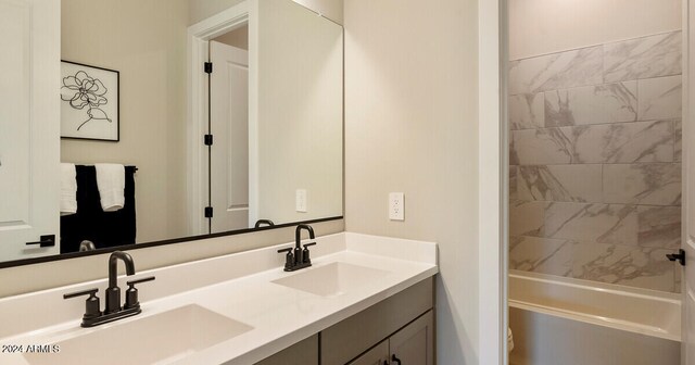 bathroom with vanity and shower with separate bathtub