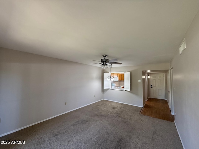131 N Higley Rd Unit 215, Mesa, AZ 85205 - unfurnished living room with dark carpet and ceiling fan