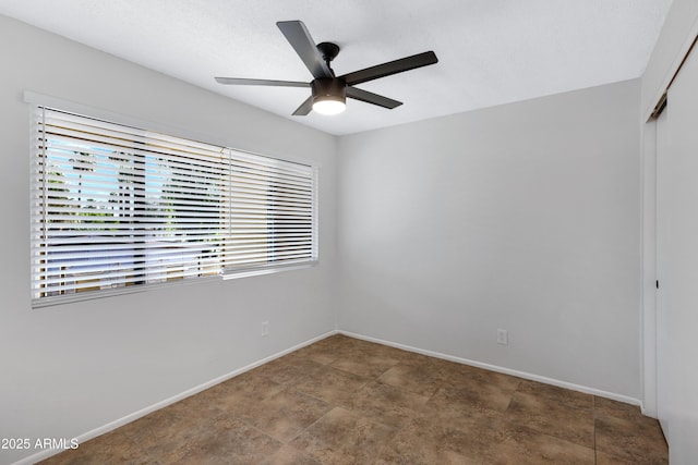 unfurnished room featuring ceiling fan