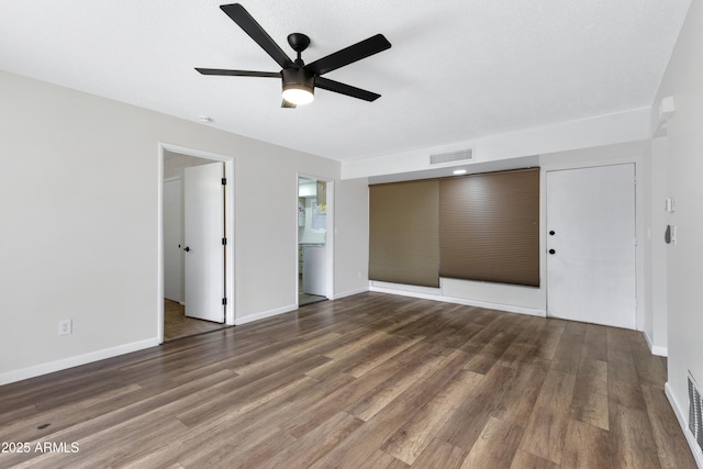 interior space featuring ceiling fan and dark hardwood / wood-style flooring