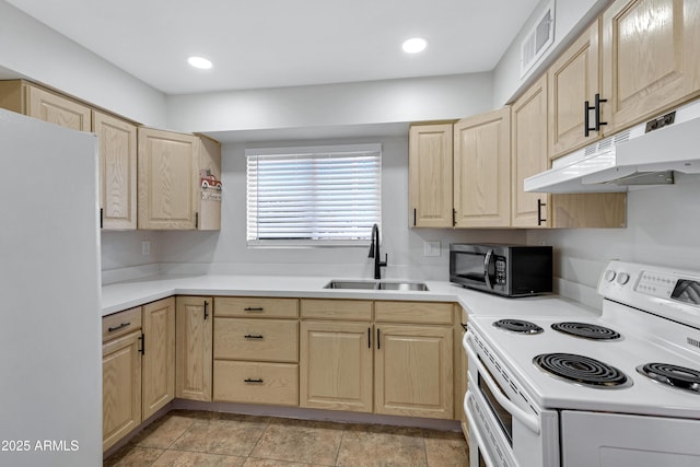 kitchen with light brown cabinetry, sink, and white appliances