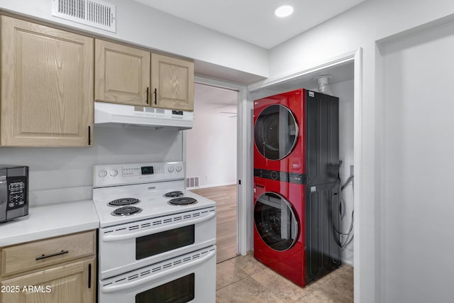 kitchen featuring stacked washing maching and dryer, white electric range, and light brown cabinets