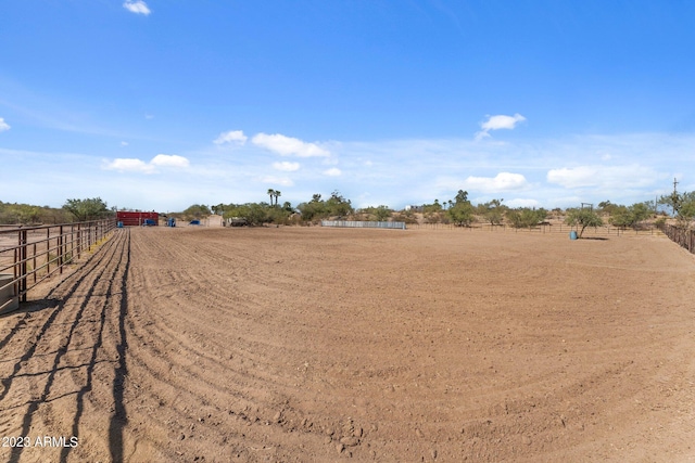 view of yard with a rural view