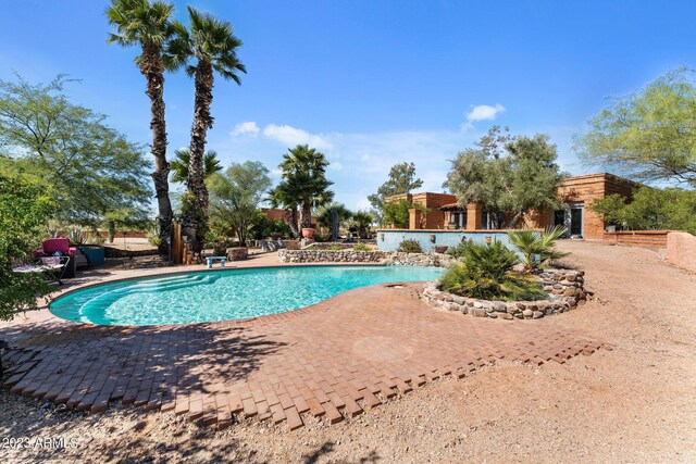 view of swimming pool featuring a patio area