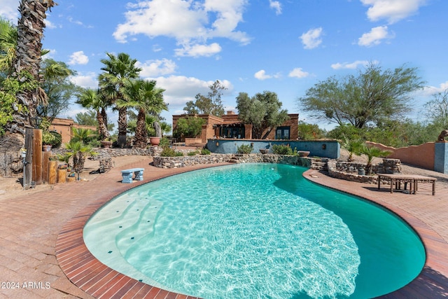 view of swimming pool featuring a patio area