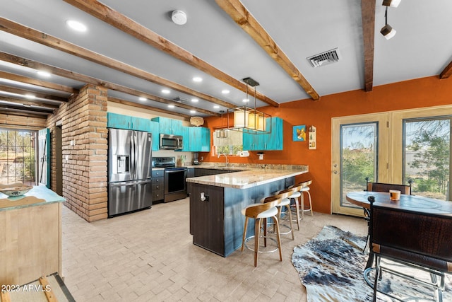 kitchen with a kitchen bar, decorative light fixtures, appliances with stainless steel finishes, and beam ceiling