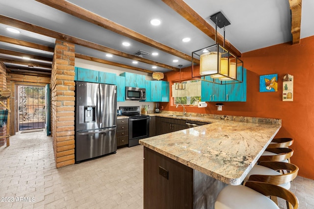 kitchen featuring pendant lighting, kitchen peninsula, appliances with stainless steel finishes, a breakfast bar area, and beam ceiling