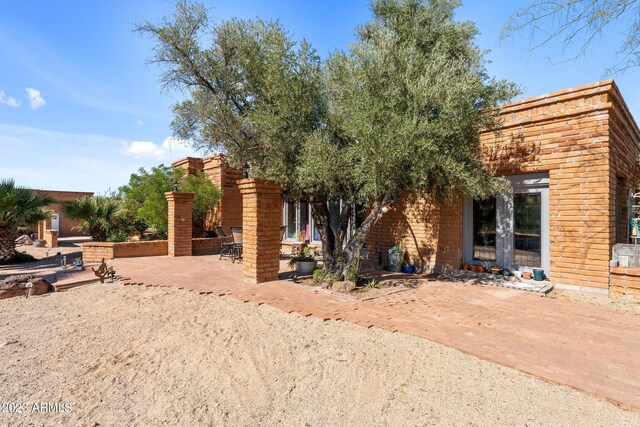 view of front facade with a patio