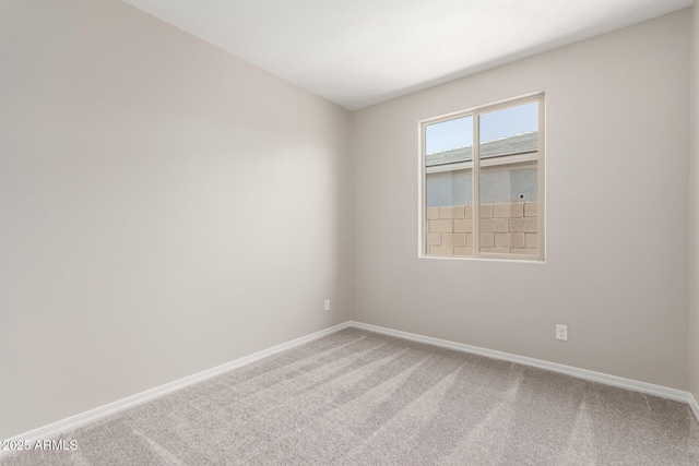 spare room featuring carpet flooring