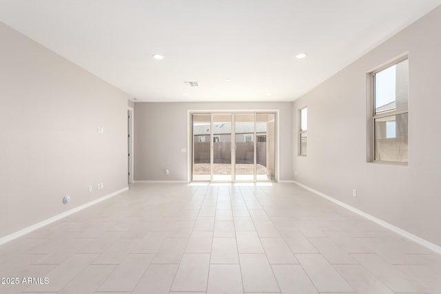 empty room with light tile patterned flooring