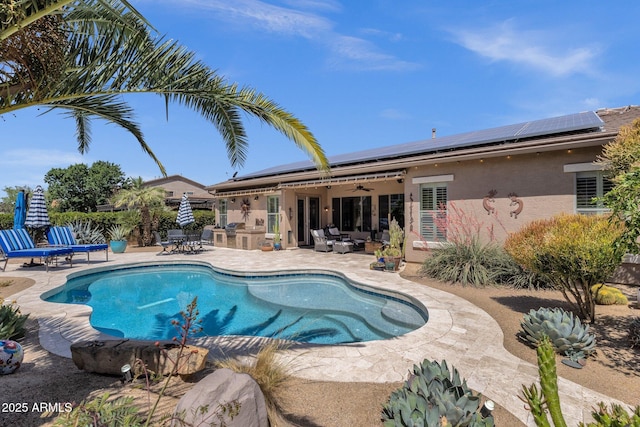 10359 E Los Lagos Vista Ave, Mesa, AZ 85209 - swimming pool with a patio area, a ceiling fan, an outdoor hangout area, an outdoor kitchen, and outdoor dining area