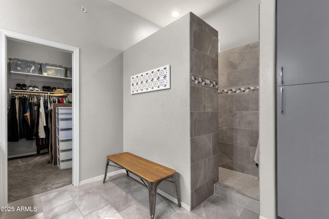 10359 E Los Lagos Vista Ave, Mesa, AZ 85209 - full bathroom featuring walk in shower, a spacious closet, and baseboards