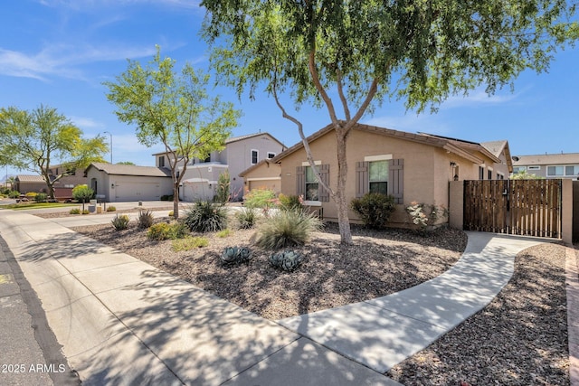 10359 E Los Lagos Vista Ave, Mesa, AZ 85209 - view of front of property featuring stucco siding, a gate, fence, and a residential view