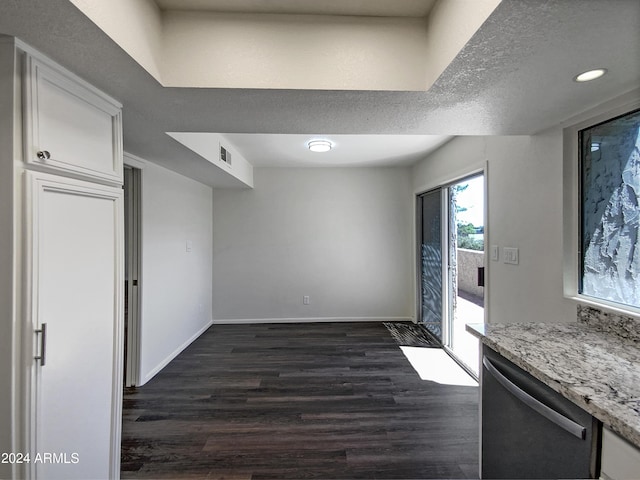 kitchen featuring dark hardwood / wood-style flooring, light stone counters, a textured ceiling, dishwasher, and white cabinetry