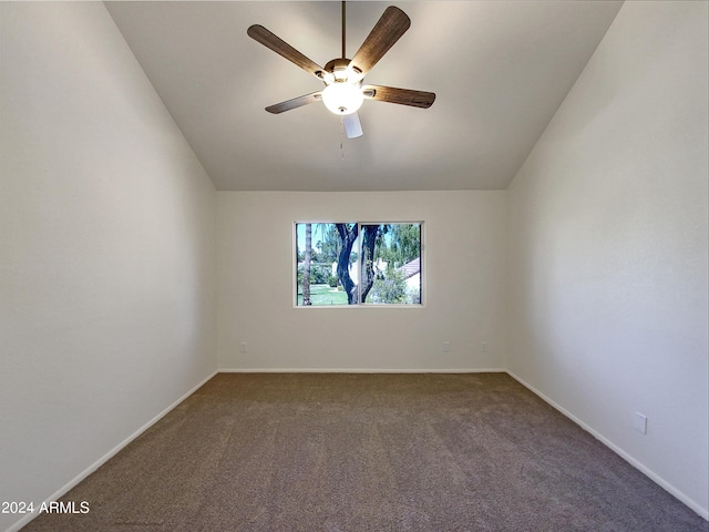 empty room featuring carpet, ceiling fan, and lofted ceiling