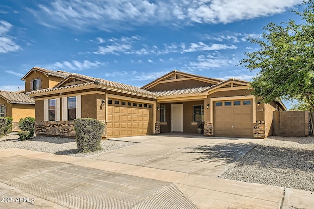 ranch-style home with an attached garage, stucco siding, a tile roof, fence, and driveway