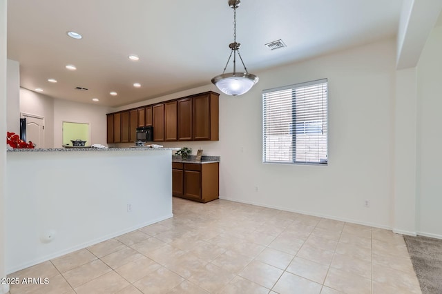 6815 W Carter Rd, Laveen, AZ 85339 - kitchen featuring black microwave, recessed lighting, pendant lighting, light tile patterned floors, and light stone counters
