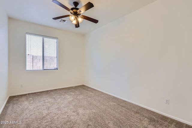 6815 W Carter Rd, Laveen, AZ 85339 - spare room with carpet flooring, a ceiling fan, and baseboards