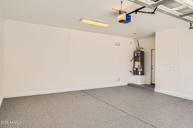 6815 W Carter Rd, Laveen, AZ 85339 - garage featuring water heater, a garage door opener, and baseboards